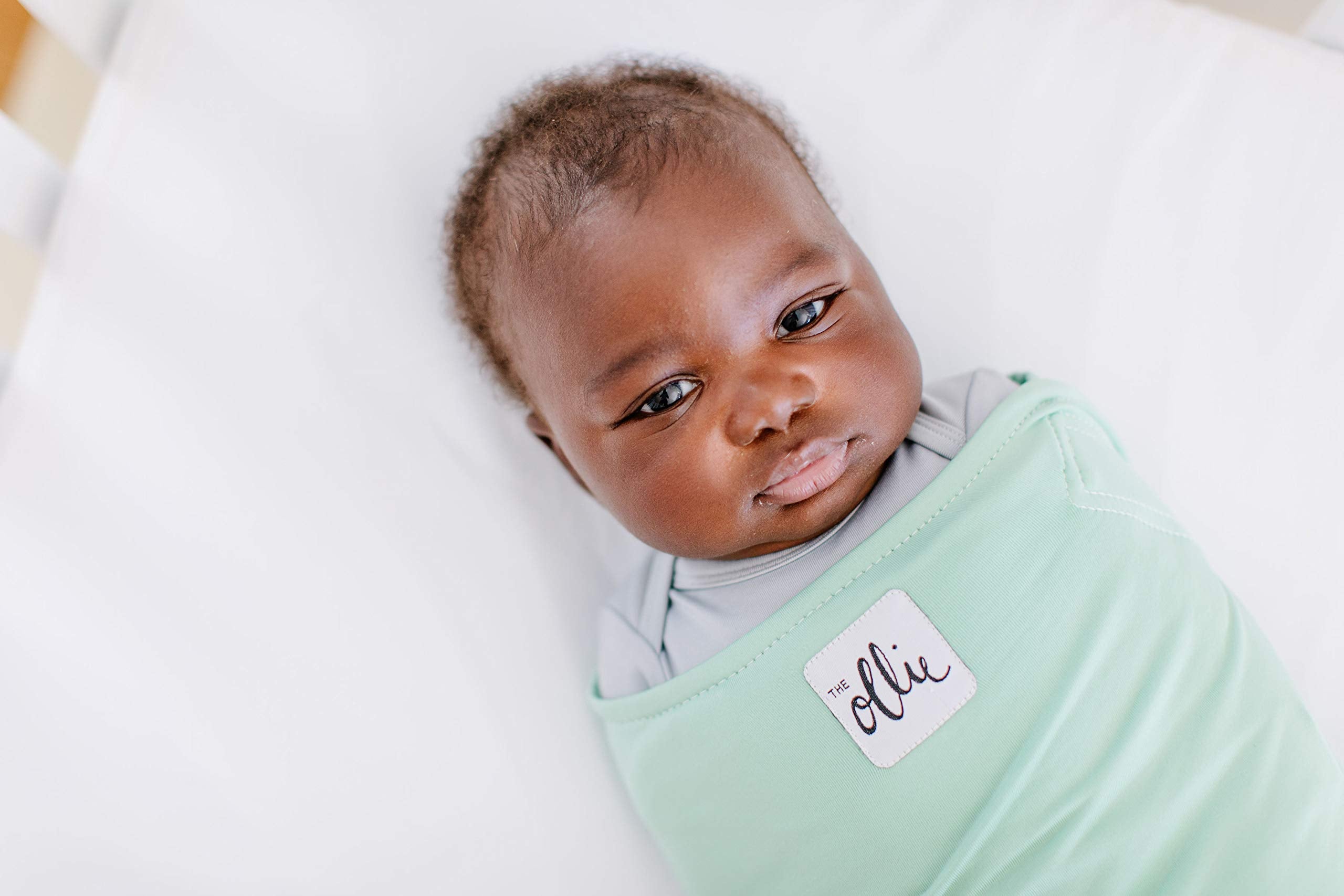The Ollie Swaddle lightweight fabric keeps baby comfortable.