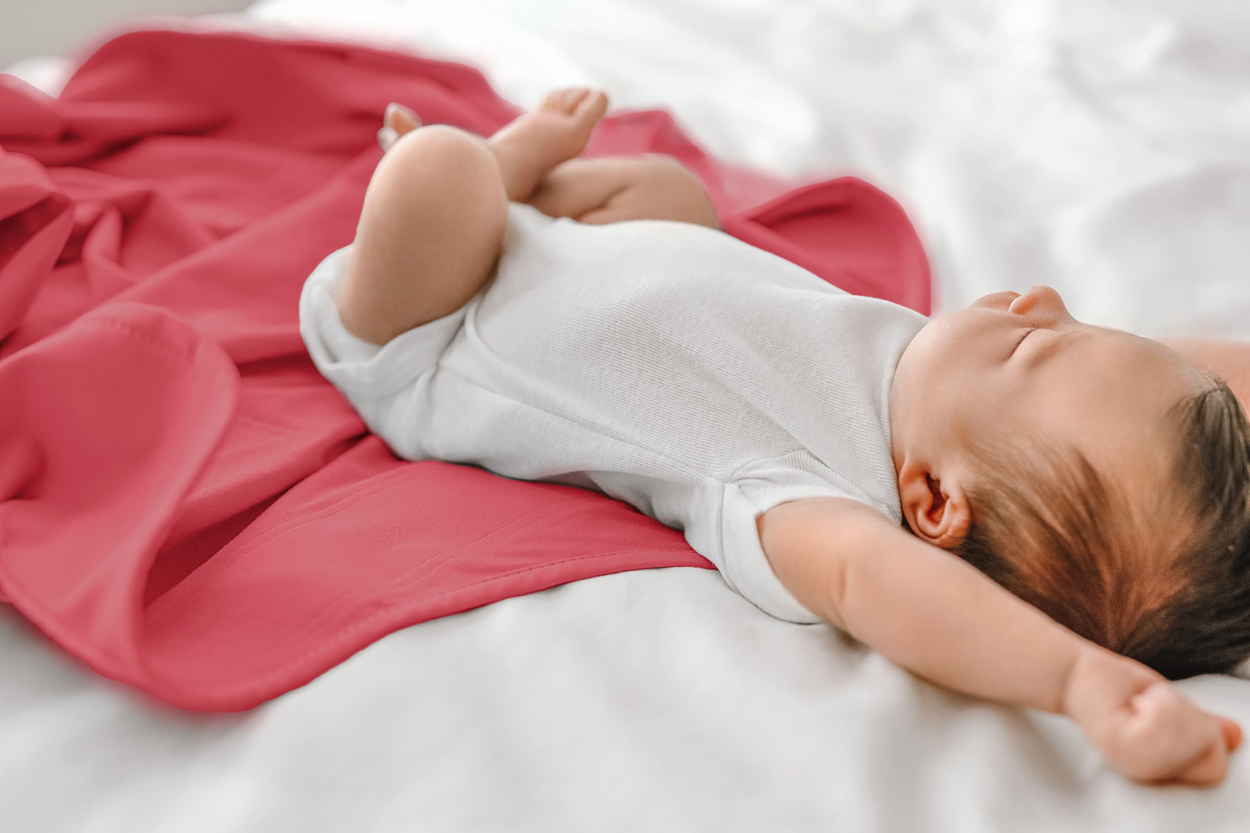 The Ollie Swaddle lightweight soft material feels gentle against the baby's skin.