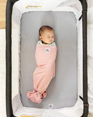 The Ollie Swaddle open-bottom-design enables quick diaper changes
