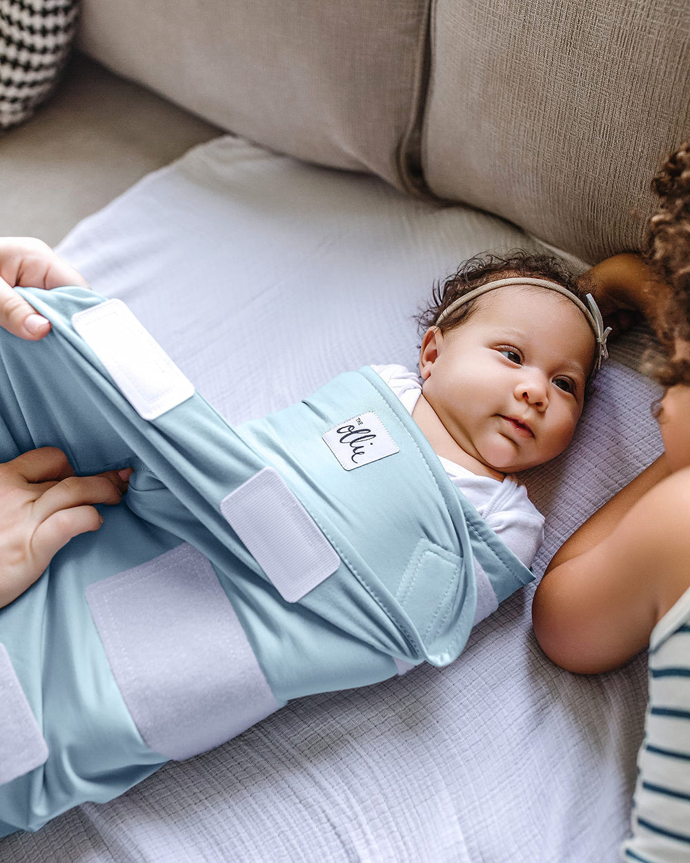 The Ollie Swaddle open-bottom feature makes diaper access quick and calm.