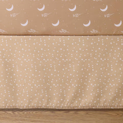 The Peanutshell celestial patchwork detail adds playful texture to the nursery decor.