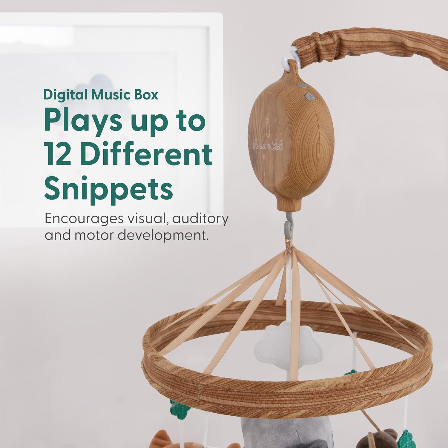 The Peanutshell woodgrain music box mobile offers 12 lullabies