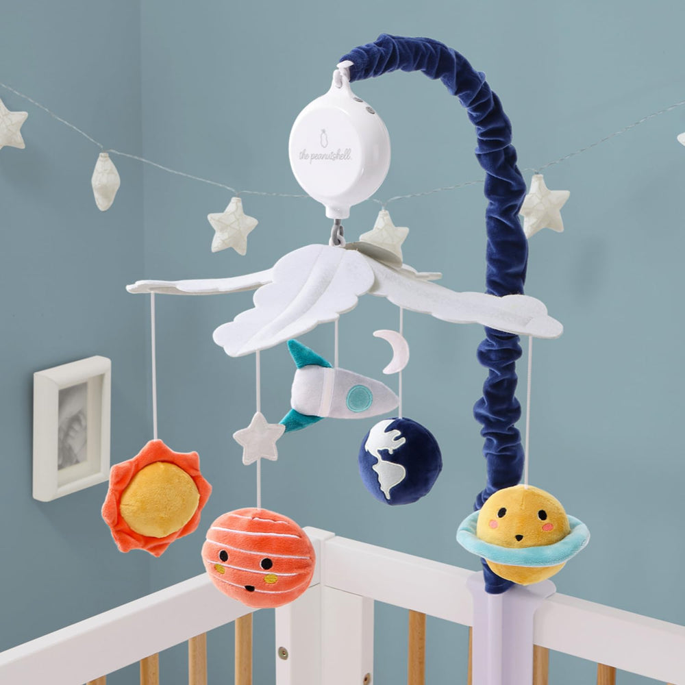 The Peanutshell crib mobile offers twelve lullabies for soothing.