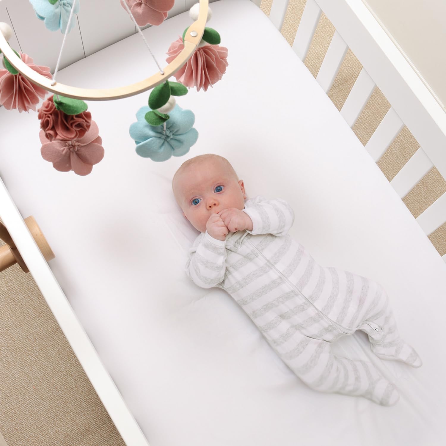 The Peanutshell detachable-arm crib mobile enables easy relocation and storage.