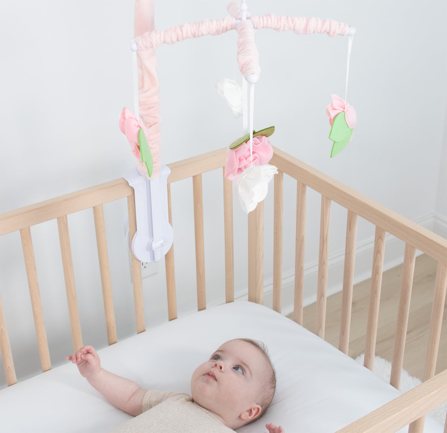 The Peanutshell detachable-arm crib mobile moves easily for redecorating.
