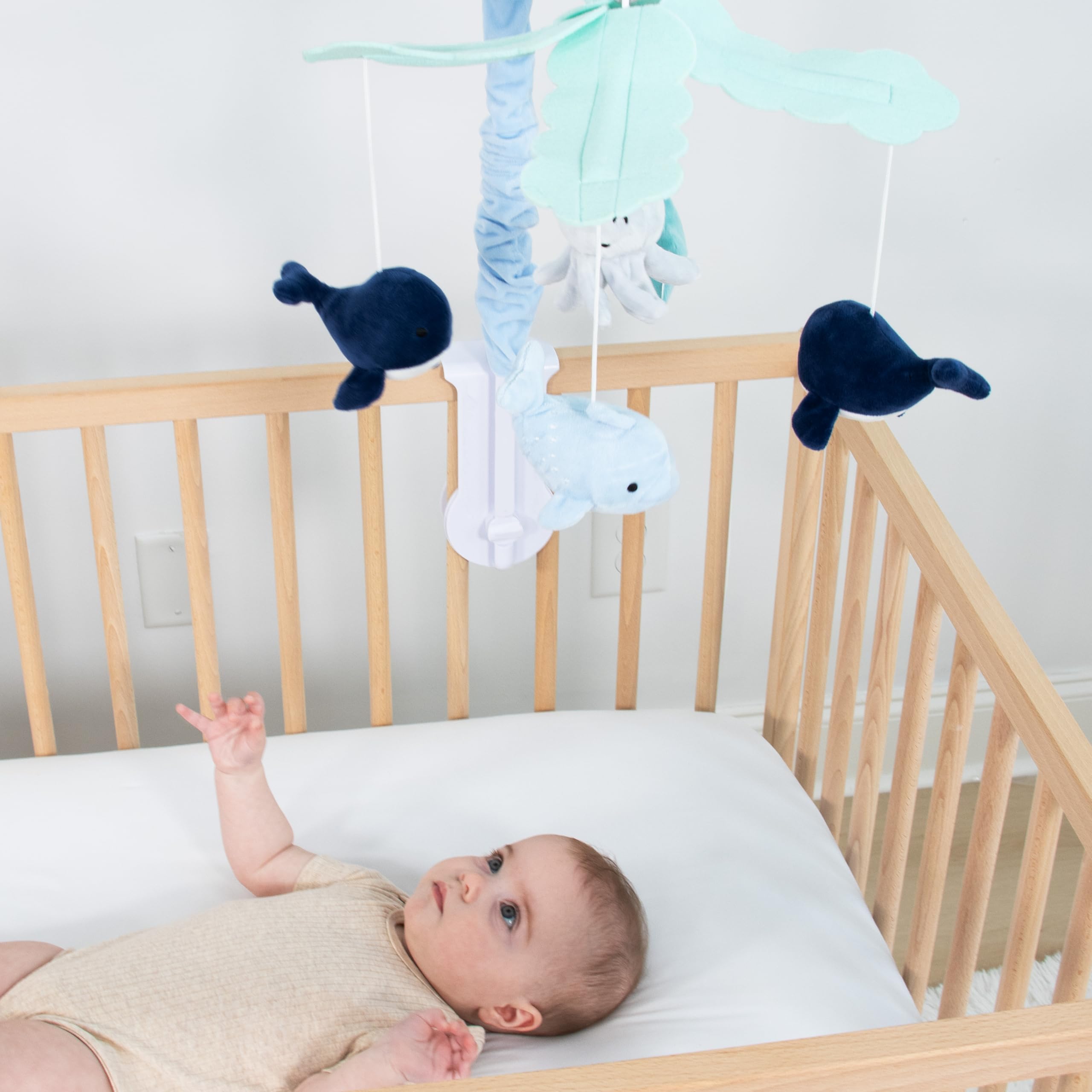 The Peanutshell detachable-arm crib mobile simplifies moving and storage.