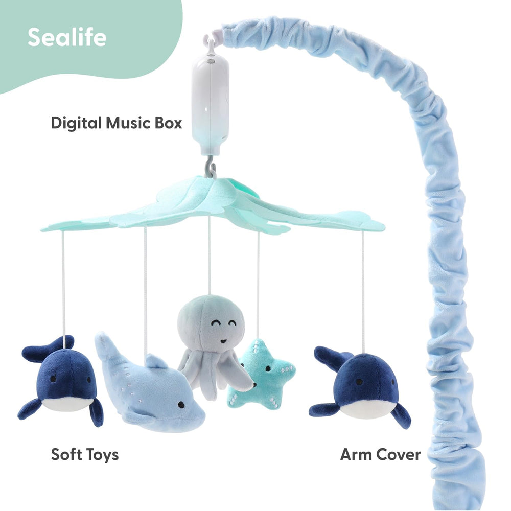 The Peanutshell crib mobile dolphin rotation showcases gentle ocean motion.
