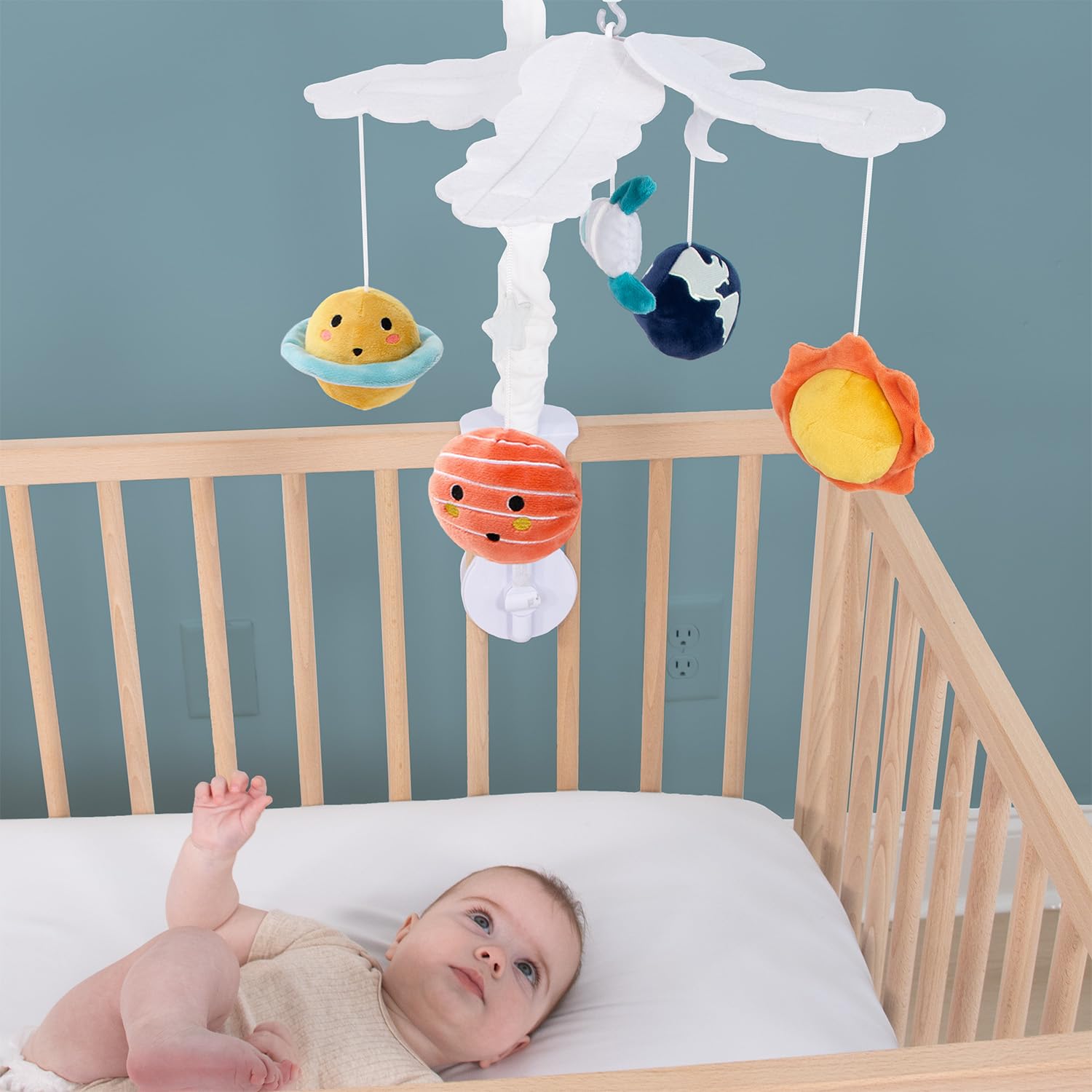 The Peanutshell crib mobile fits standard cribs for quick setup.