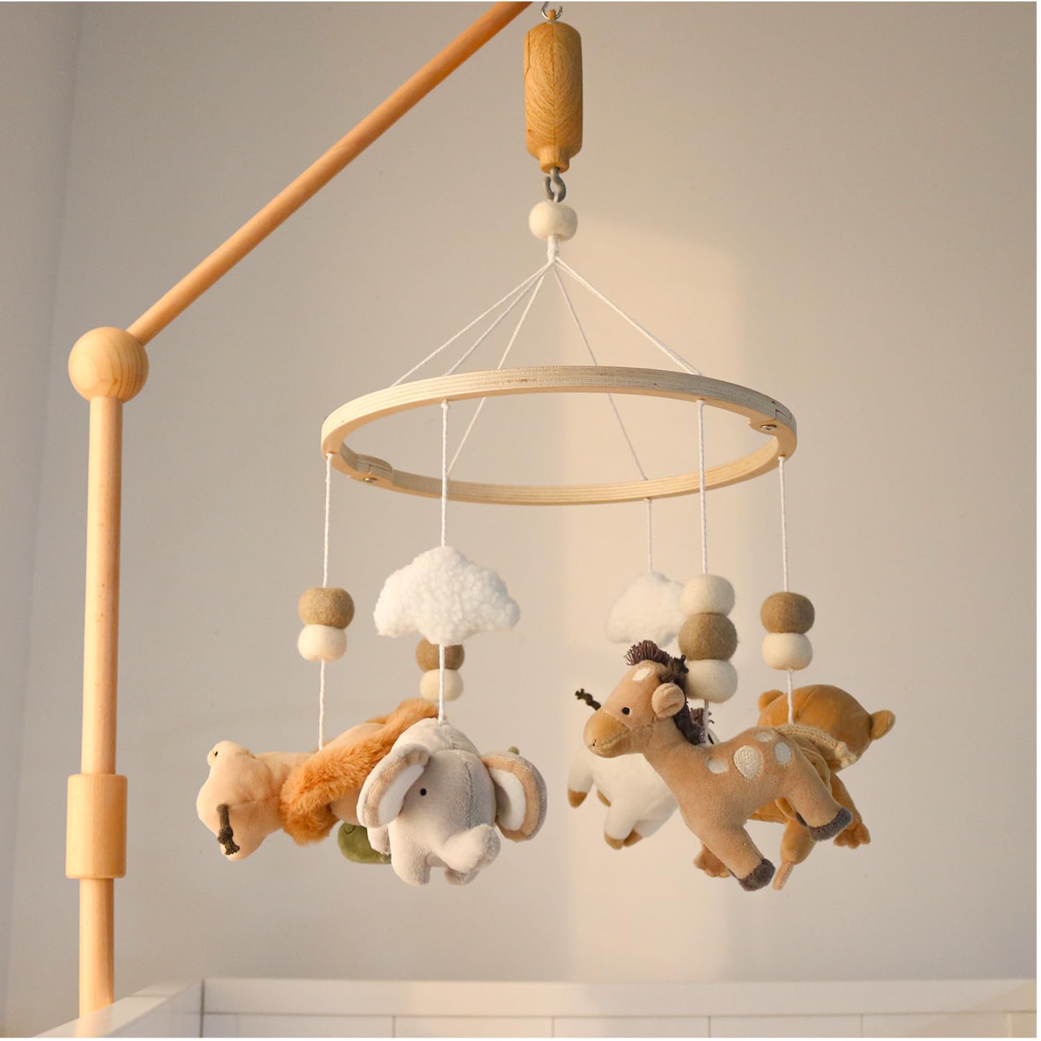 The Peanutshell crib mobile turtle pairs wood finish with gentle rotation for nesting peace.