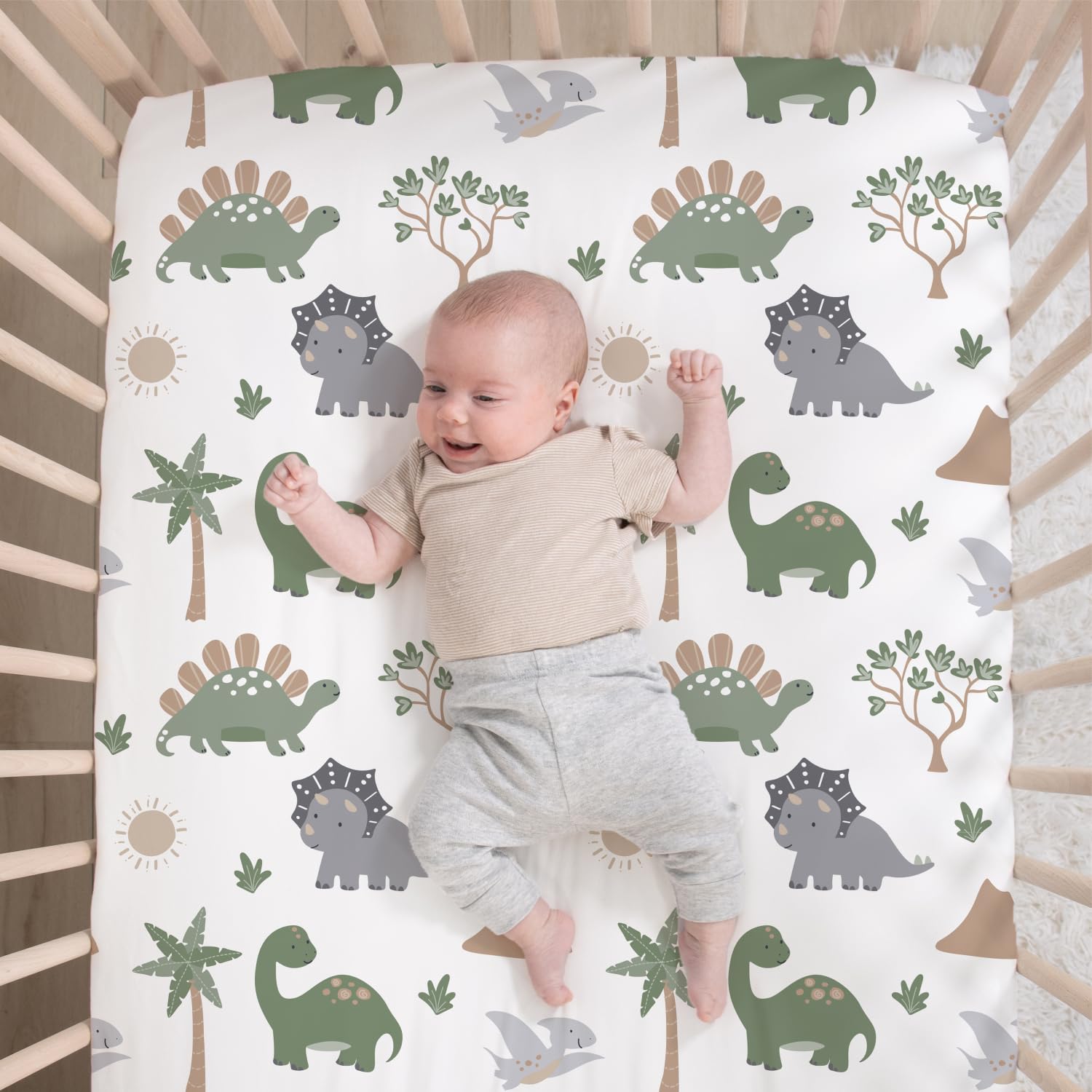 The Peanutshell Dinosaur Dreams bed skirt finishes the nursery with tidy elegance
