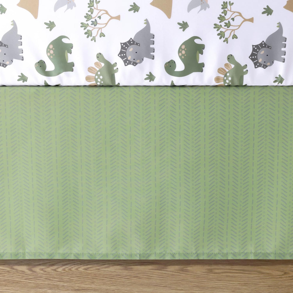 The Peanutshell Dinosaur Dreams nursery scene showcases cheerful dinosaurs on camouflage tones