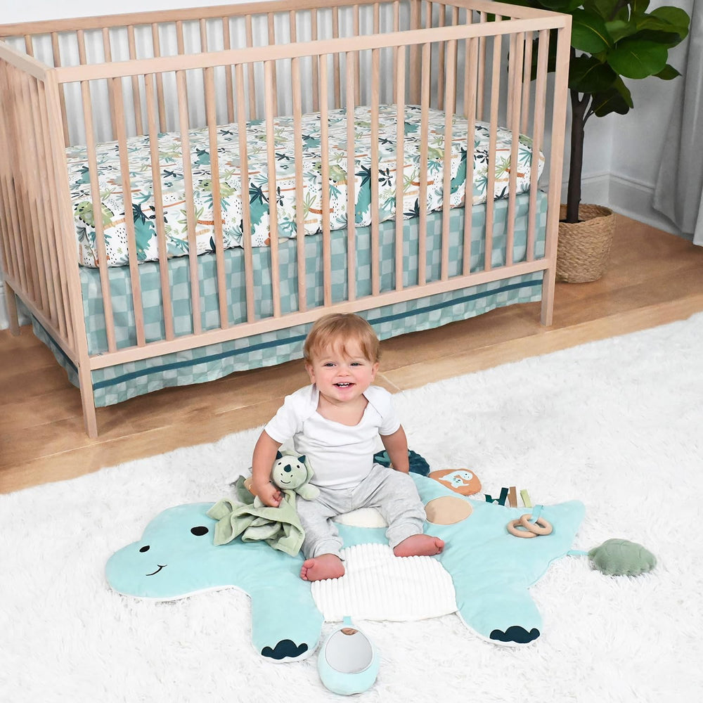 The Peanutshell dinosaur fitted crib sheet brightens a standard crib and supports a snug fit