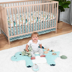 The Peanutshell dinosaur fitted crib sheet brightens a standard crib and supports a snug fit