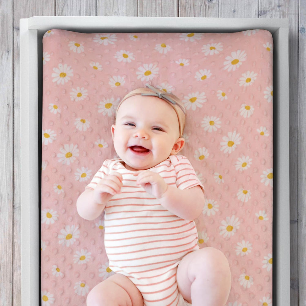 The Peanutshell minky dot velour cover adds soft comfort for diaper changes.