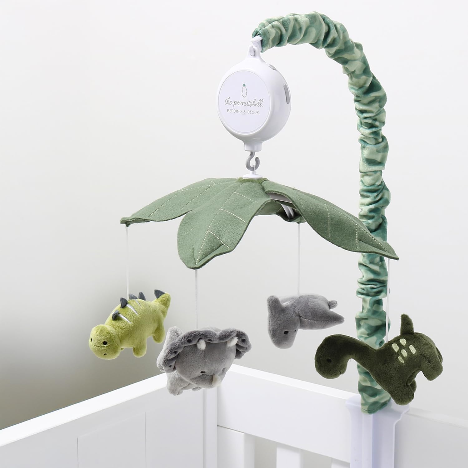 The Peanutshell nursery decor in green camo adds playful style.