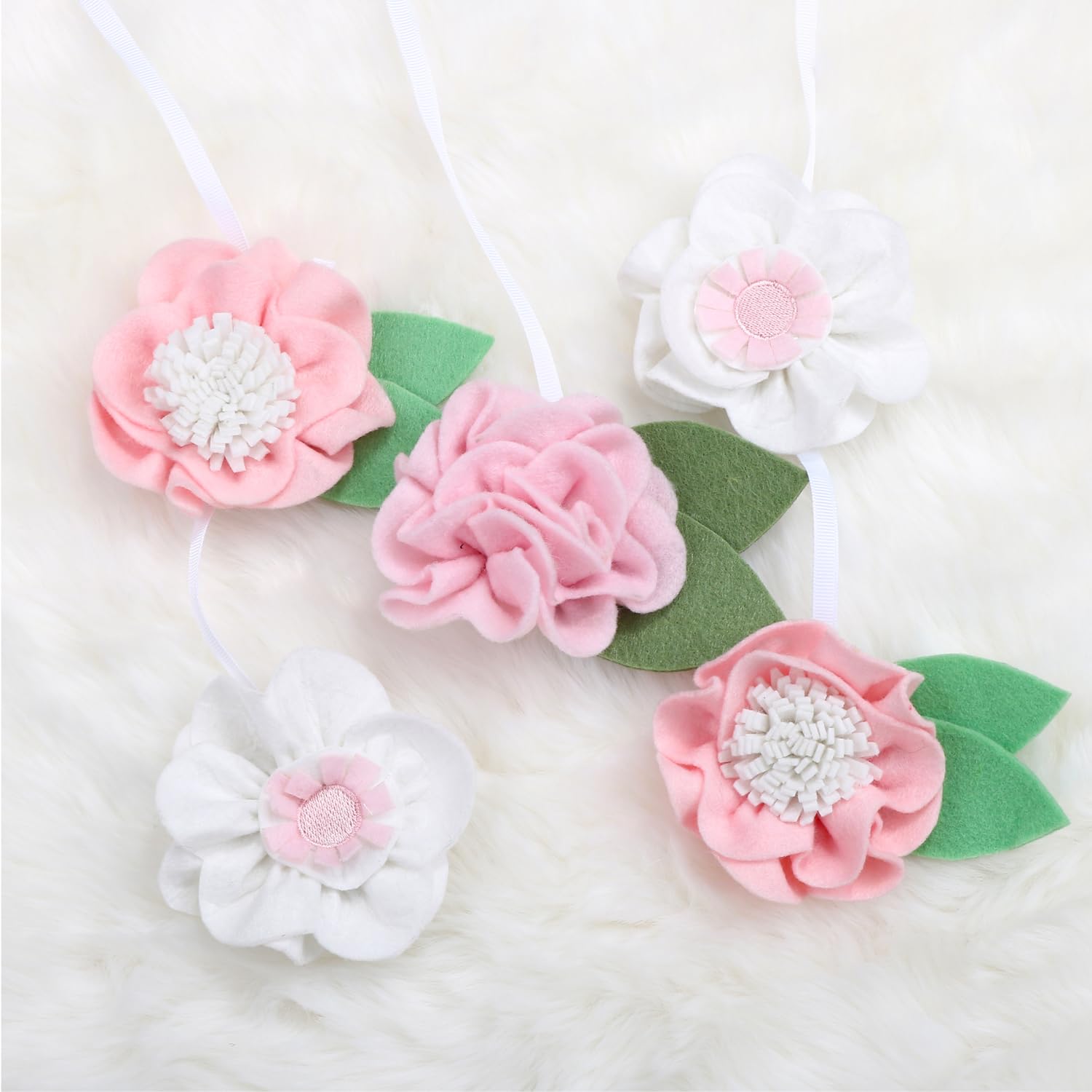 The Peanutshell pink-bloom mobile brightens the nursery while soothing.