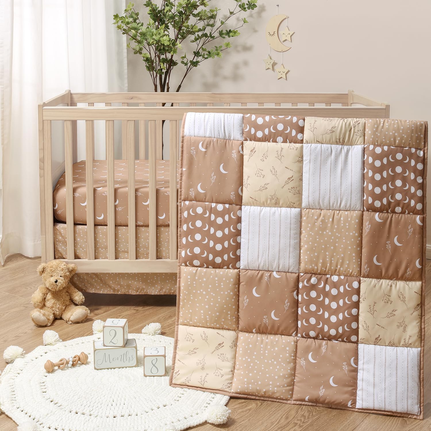 The Peanutshell nursery layout shows a cohesive celestial theme with this bedding set.