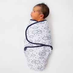 The Peanutshell Twinkle Twinkle swaddle with navy aqua cloud design for soothing visuals.