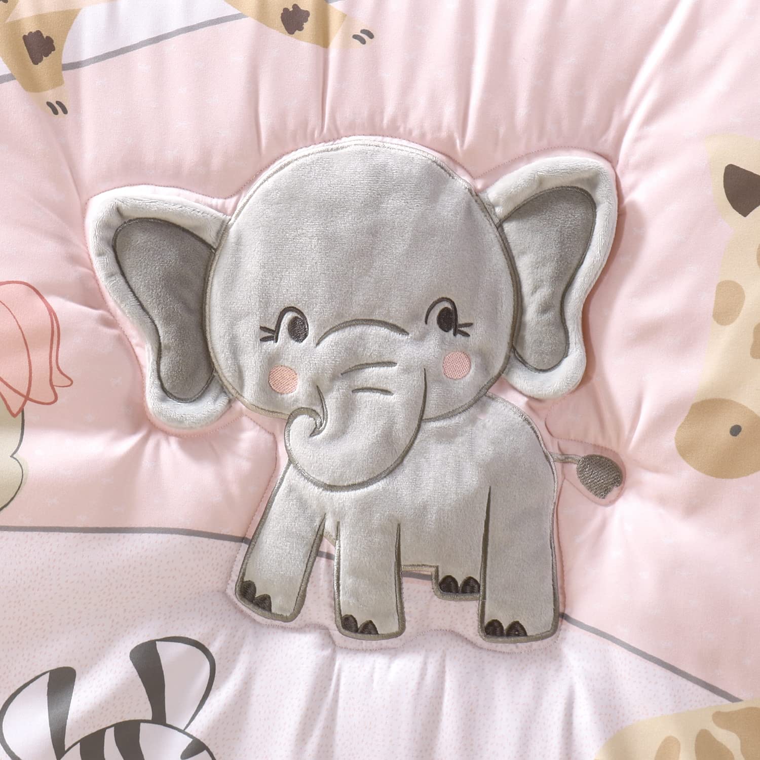 The Peanutshell Wildest Dreams pink-and-white nursery scene showcases vibrant, easy-care materials.