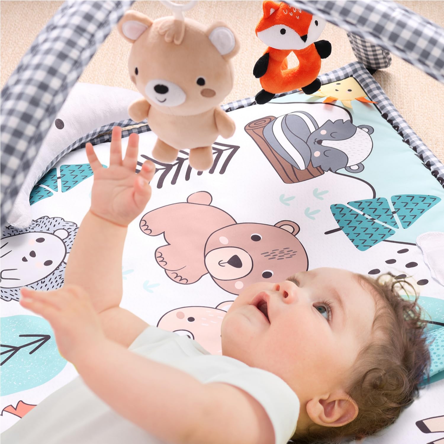 The Peanutshell woodland play mat offers soft padding for newborn tummy time.