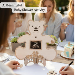 The Real Bossy Baby wooden heart tokens invite guests to sign and remember.