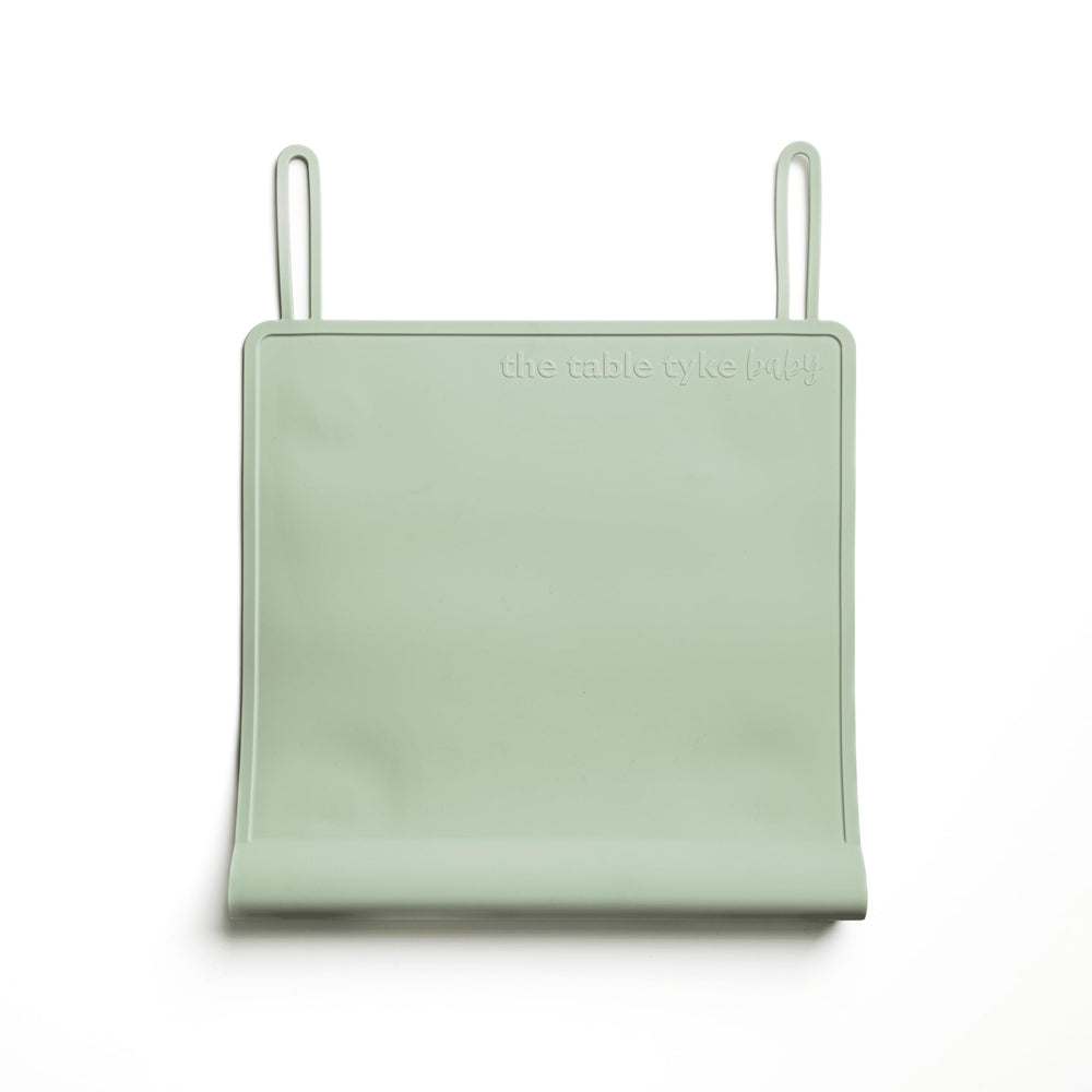 The Table Tyke placemat in Sage Green with edge bumper for safe dining surfaces
