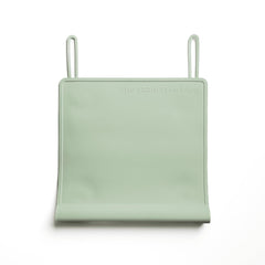 The Table Tyke placemat in Sage Green with edge bumper for safe dining surfaces