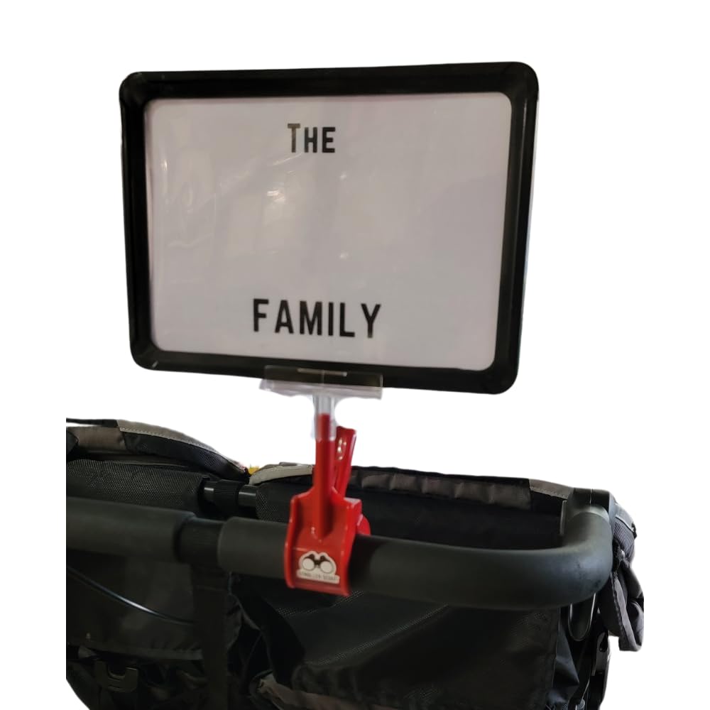 The Uncommon Reserve Stroller Scout clip-on sign attached to a stroller handle for quick spotting.