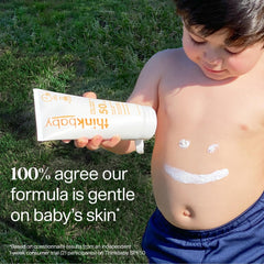 Thinkbaby SPF 50+ being spread on baby's skin with quick absorption.