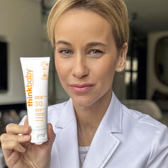 Thinkbaby water-resistant sunscreen protecting skin while swimming.