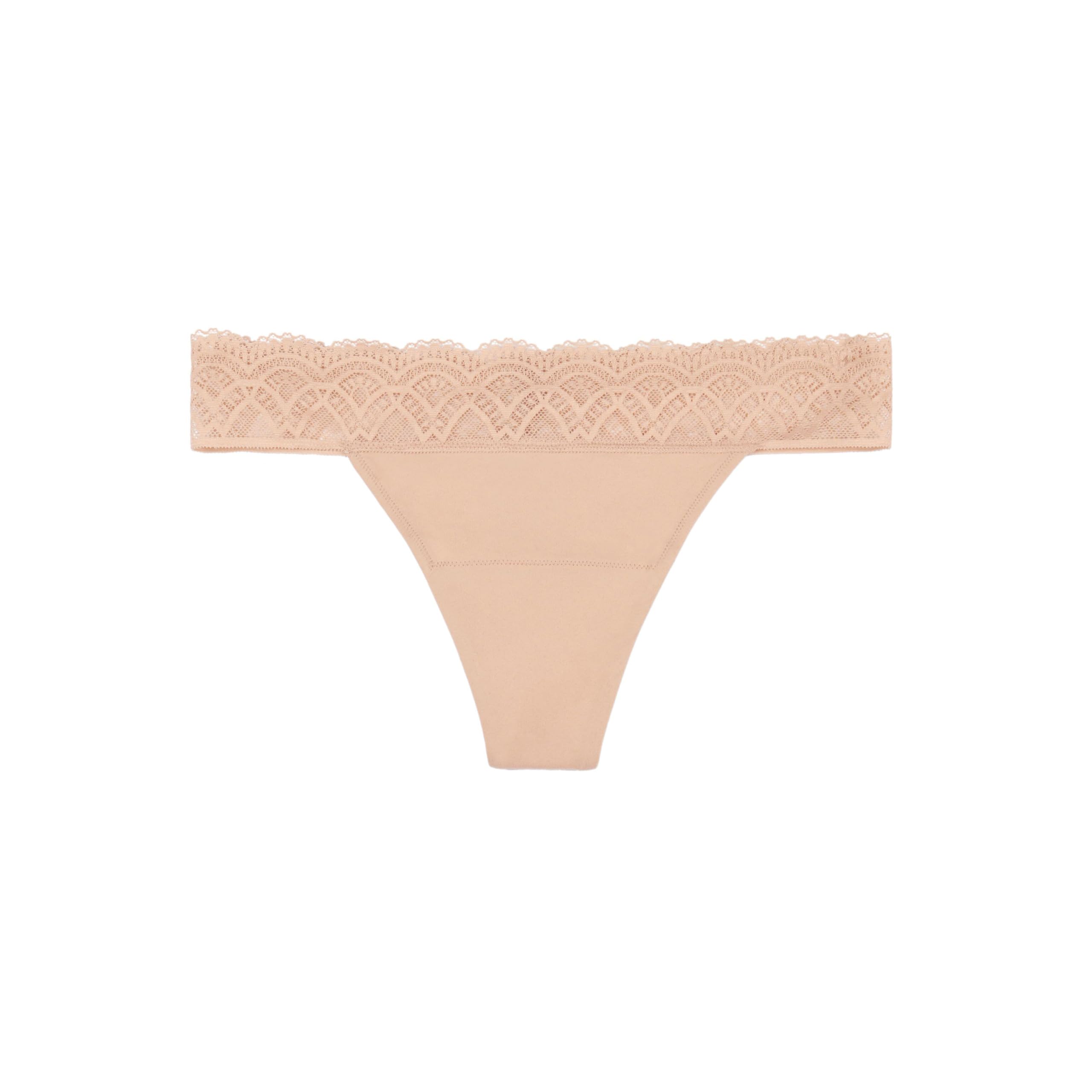 Thinx For All Leaks beige thong underwear worn on model for everyday comfort