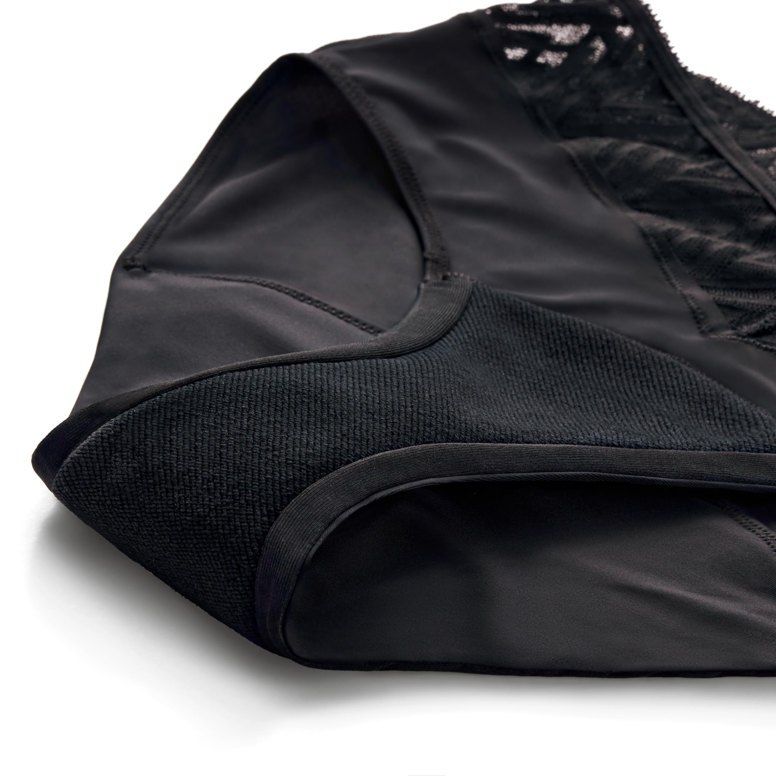 Thinx leakproof barrier visible on black underwear indicating all-day protection.