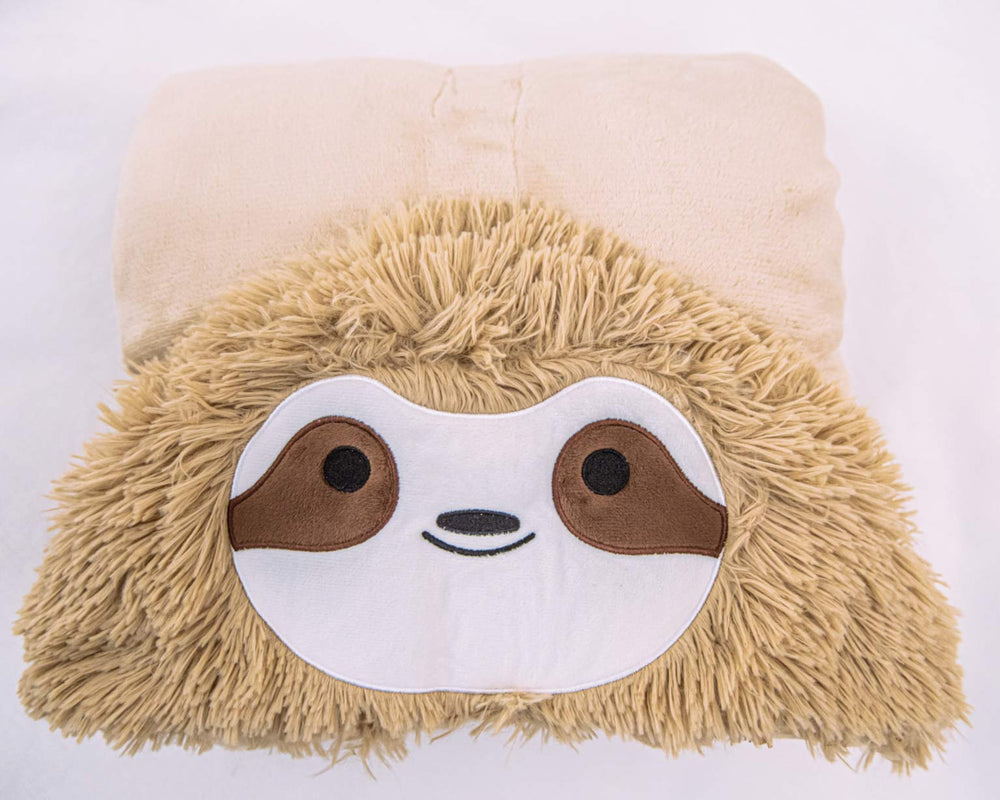 Thnapple Slothy hooded blanket draped on a couch for instant lounging