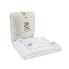 Threadmill Muslin Baby Blanket shown in 4-layer swaddle for soft, breathable wrapping