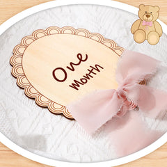 Threehoney pink ribbon detail complements nursery decor in baby photos.