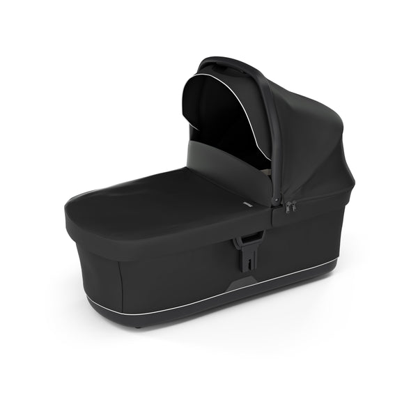 Thule bassinet with extended canopy offering sun protection and comfort
