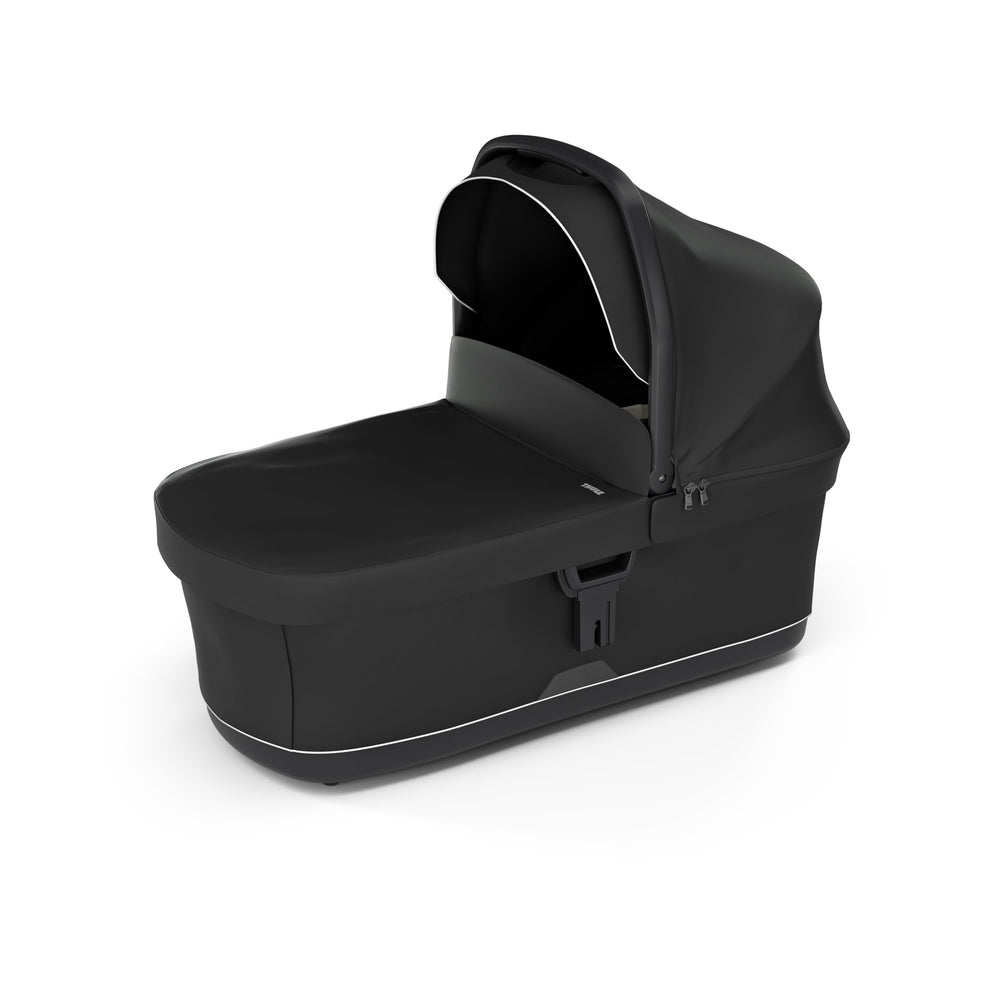 Thule bassinet with extended canopy offering sun protection and comfort