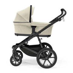 Thule Bassinet Soft Beige ventilated base promotes airflow for a comfortable nap.