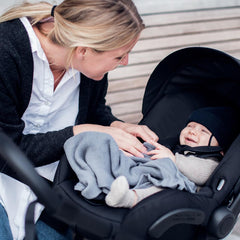 Thule Shine Chicco car seat adapter in use linking seat to stroller for seamless transitions.