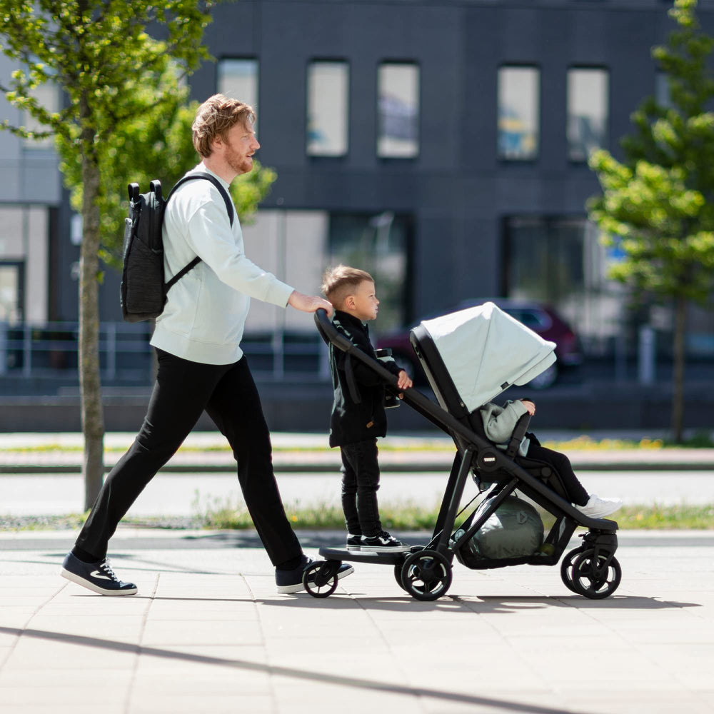 Thule Stroller Rider Board elastic cord for quick stowaway storage.