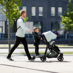 Thule Stroller Rider Board elastic cord for quick stowaway storage.