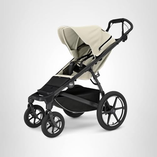 Thule Urban Glide 4-Wheel in use with baby on a stroll.