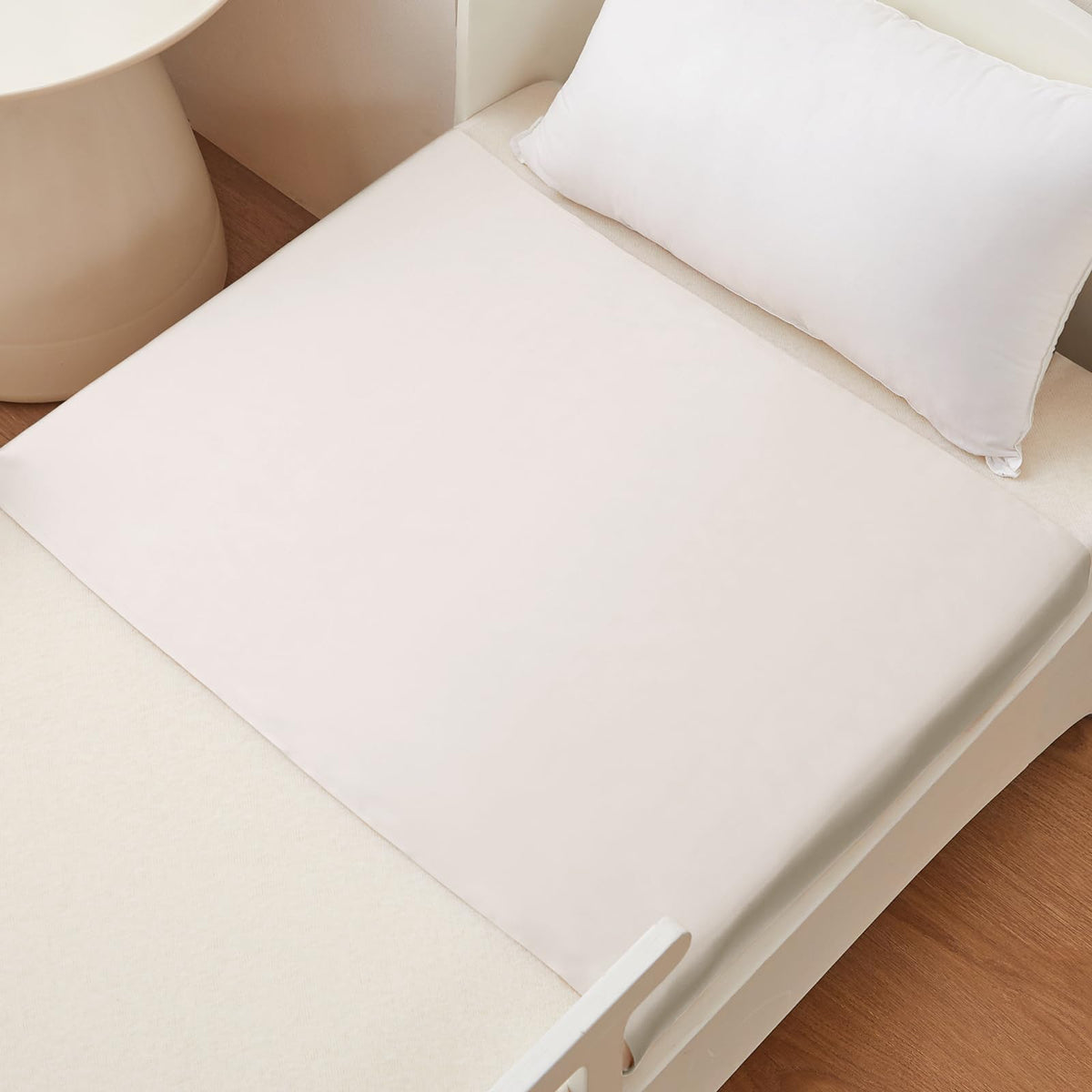 THXSILK baby crib sleeve shows easy attachment for secure fit and hair protection