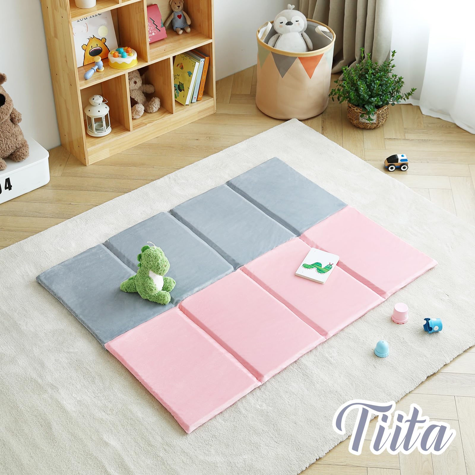 Tiita nap mat being carried by hand, highlighting its portable design.