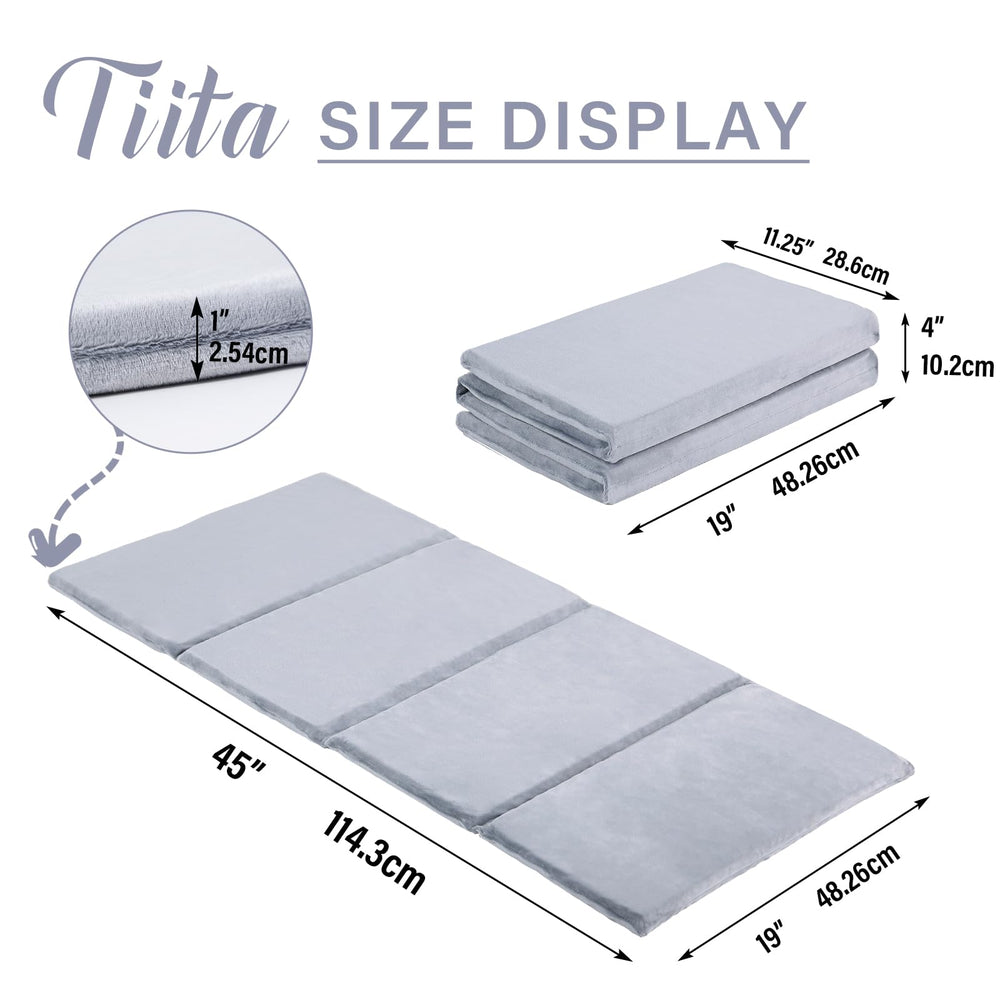 Tiita mat set up as a portable play and nap space in a small room.