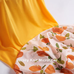 TILLYOU floral-pattern changing pad cover adds a cheerful nursery touch.