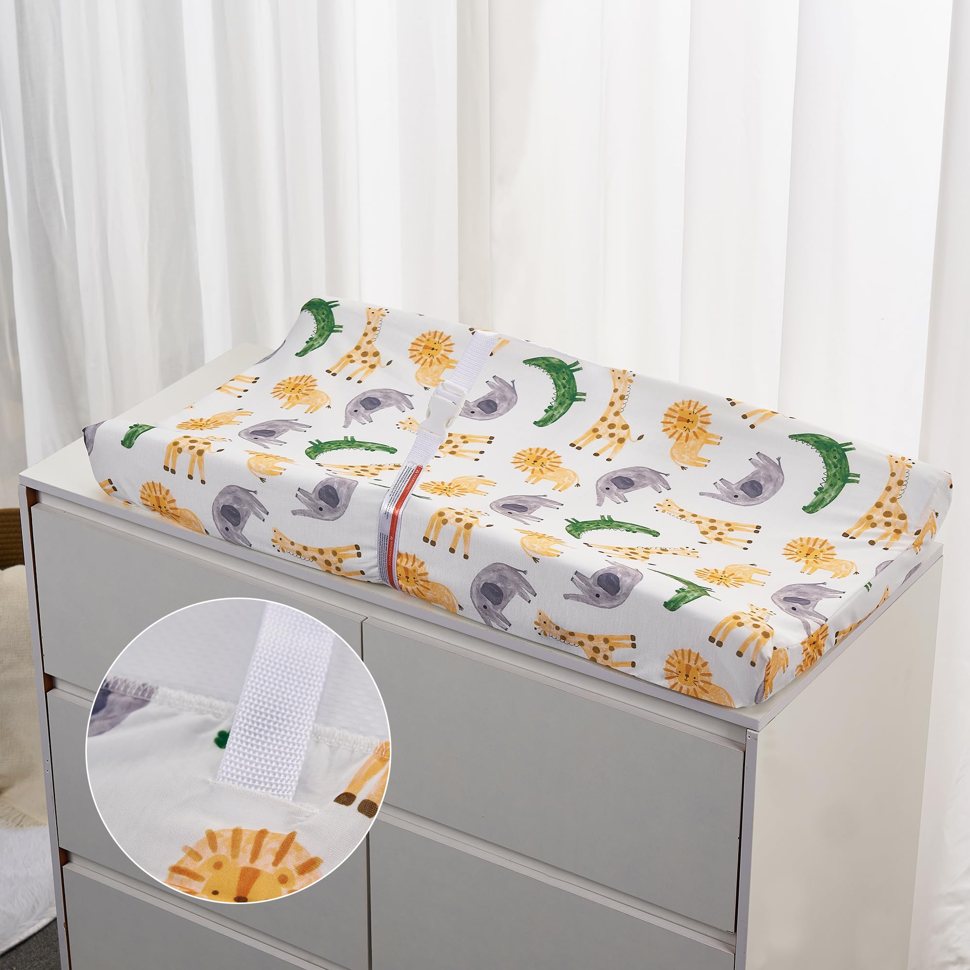 TILLYOU changing pad cover with elastic bottom and buckle holes keeps the pad secure.