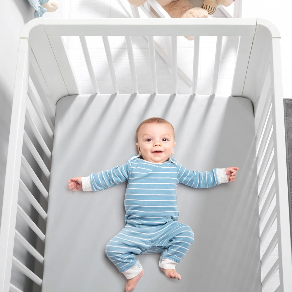 TILLYOU fitted crib sheet with 8-inch deep pockets stays secure.