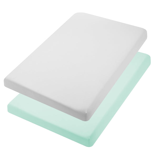 TILLYOU mini crib fitted sheet in light green wrapped snugly for a secure fit.