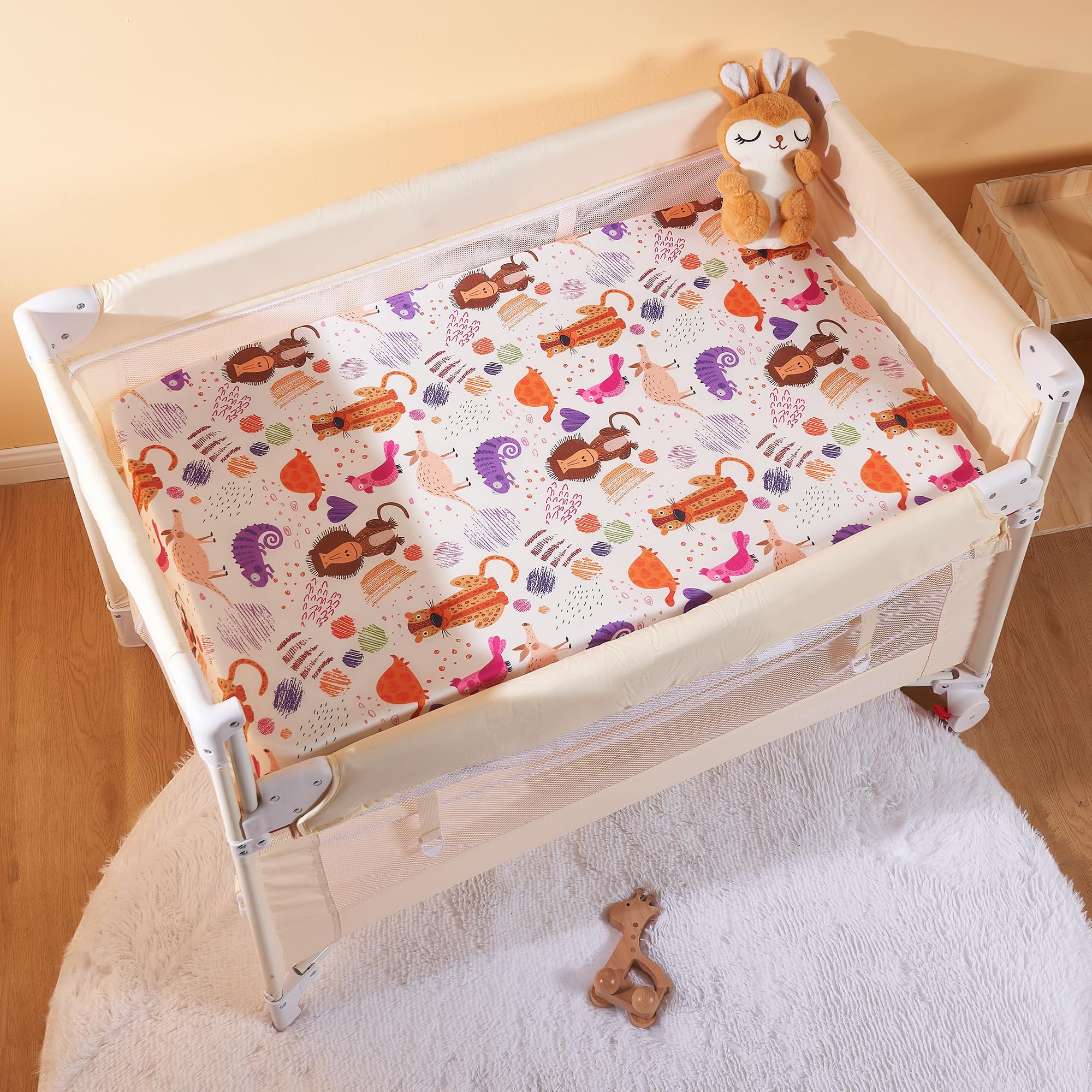 TILLYOU mini crib sheets fitted with dot printing for easy care.